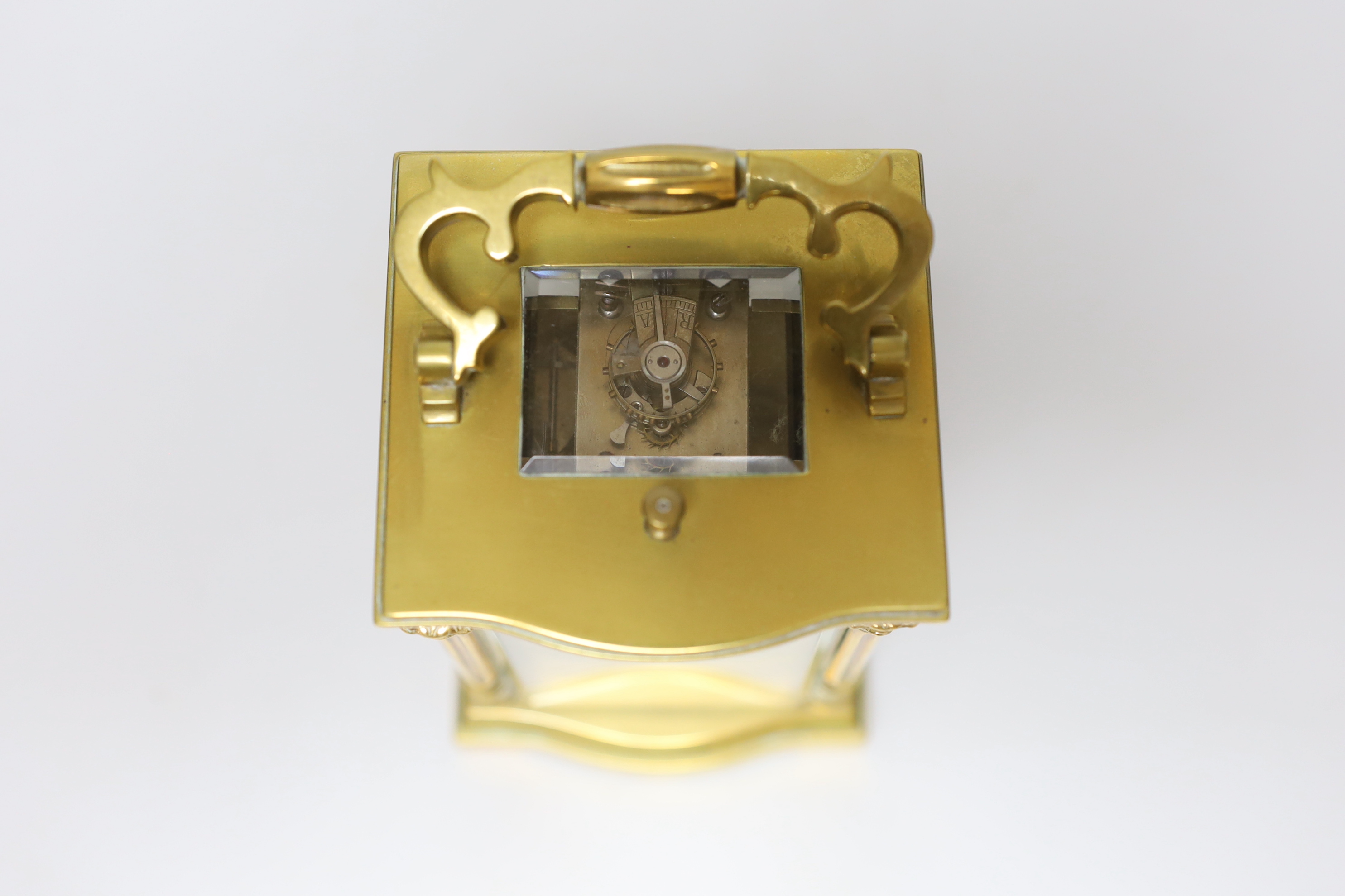An early 20th century brass repeating carriage clock with silvered dial, 16cm high